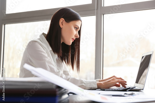 Young female accountant wor...