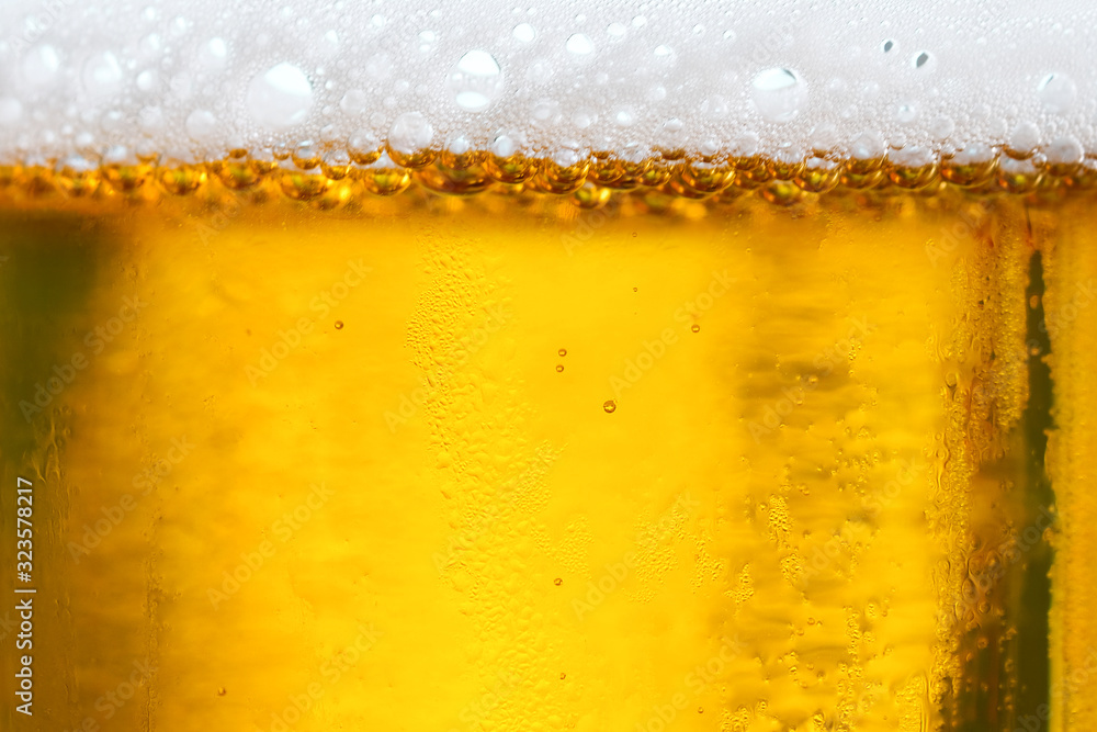 Background Cool beers with beer bubbles on top a glass at the party Background Cool beers with beer bubbles on top a glass at the party