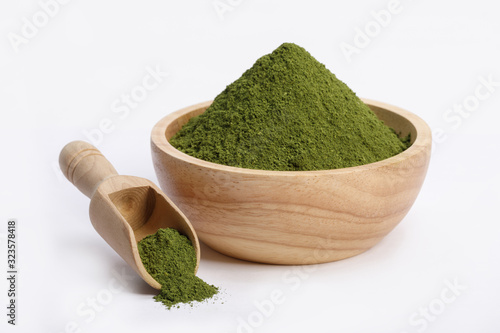 Matcha green tea powder in bowl isolated on white background, Organic product from the nature for healthy with traditional style