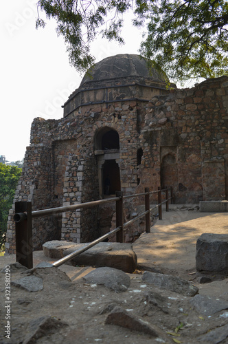 A mesmerizing view of hauz khas lake and garden from the hauz khas fort at hauz khas village at winter foggy morning. photo