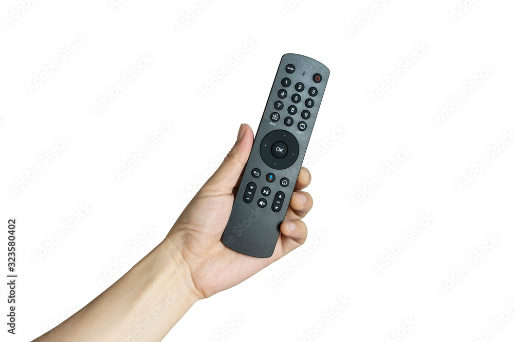 His hand is holding the remote control and operate the remote control. on the White Background . Concept of Technology His hand is holding the remote control and operate the remote control. on the White Background . Concept of Technology