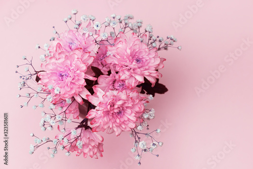 spring flowers, close-up of bright pink, pale pink chrysanthemums and small lilac flowers, bouquet composition. copy space