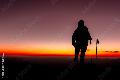 23.10.2019 Friend Group hiking Doi Monjong, Chiang Mai, Thailand., Silhouette Hiking people reaching summit giving at mountain top at sunset. Photo with high shadow and selective focus.