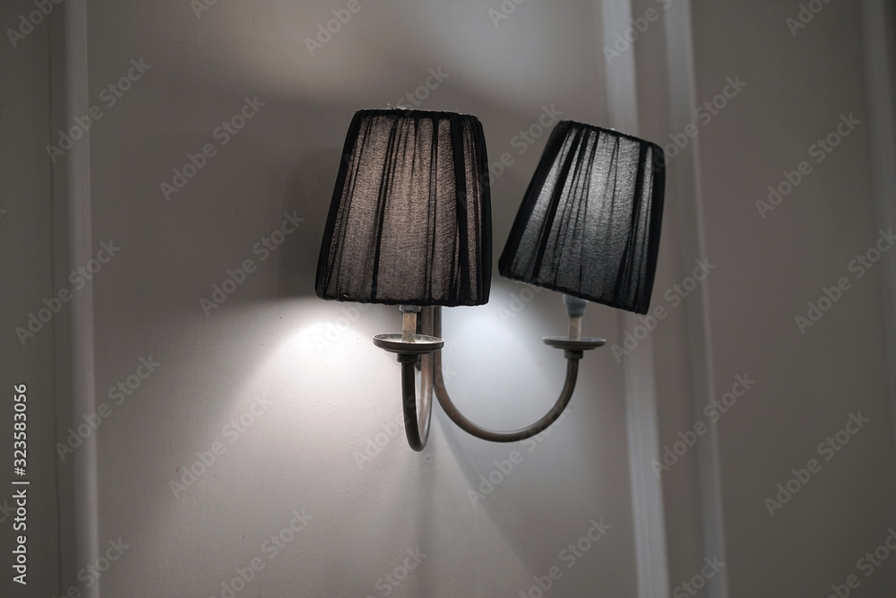 Classic lamp on the wall. Lighted lamp shade. Ray of light. Classic lamp on the wall. Lighted lamp shade. Ray of light.
