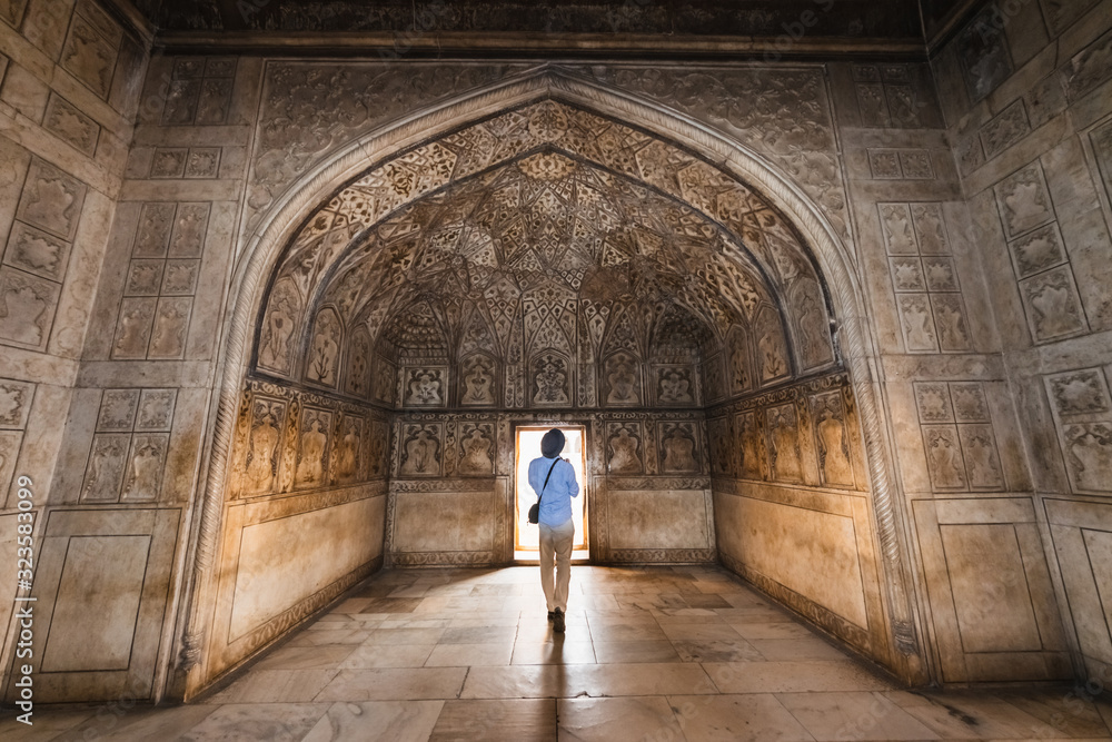 Man at hall with ethnic ornament in Khas Magal, Red Fort, Agra, India