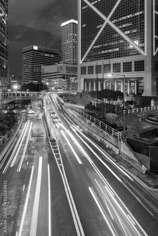 Car Traffic in central district of Hong Kong city at dusk