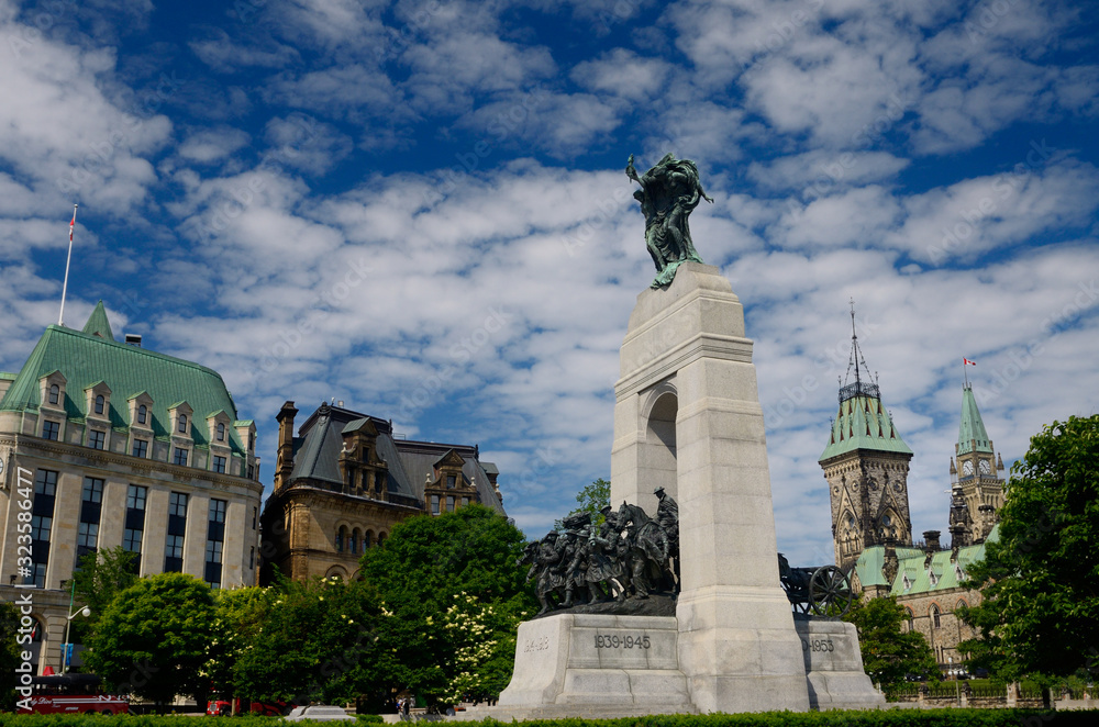 National War Memorial in Confederation Square in downtown Ottawa with Parliament Buildings