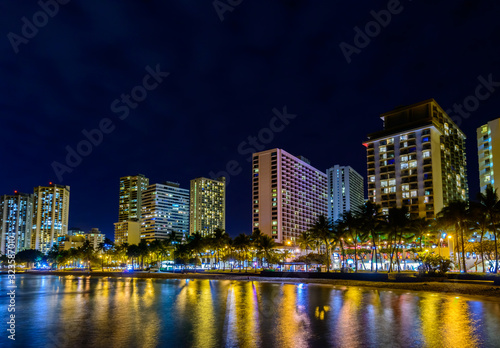 Fantastic view of tropical city at night in Honolulu, Hawaii, USA
