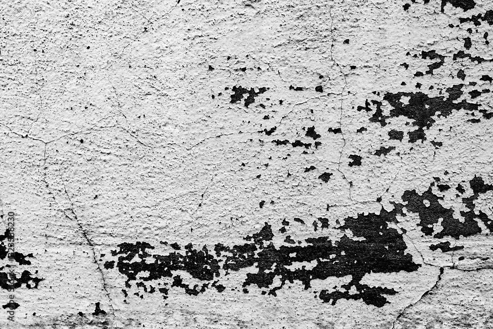 Texture of a concrete wall with cracks and scratches which can be used as a background Texture of a concrete wall with cracks and scratches which can be used as a background