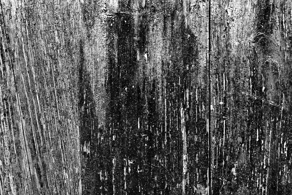 Texture of a wooden wall with cracks and scratches which can be used as a background Texture of a wooden wall with cracks and scratches which can be used as a background
