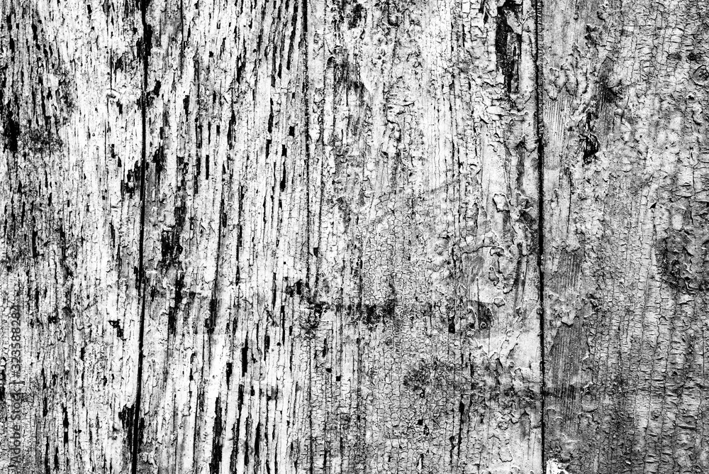 Texture of a wooden wall with cracks and scratches which can be used as a background Texture of a wooden wall with cracks and scratches which can be used as a background