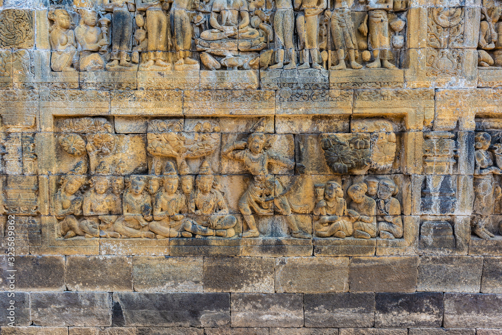 Stone carvings in Borobudur Temple, Magelang, Central Java, Indonesia. Borobudur Temple is the center for Vesak Day celebration in Indonesia,