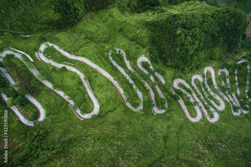 Wallpaper Mural Winding road from the high mountain pass in Guizhou,China. Aerial view. Torontodigital.ca