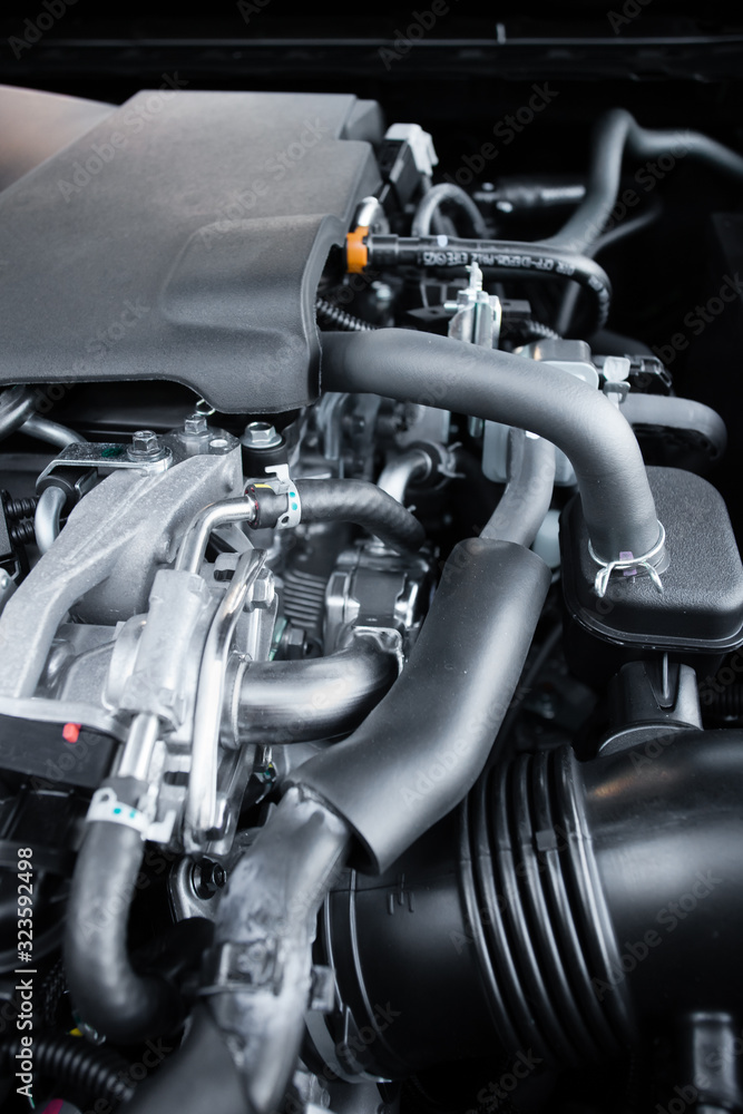 Looking under the hood of an internal combustion automobile engine Looking under the hood of an internal combustion automobile engine