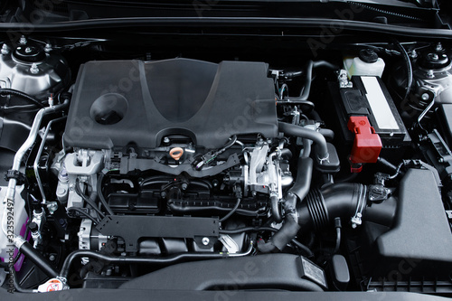 Looking under the hood of an internal combustion automobile engine © Andrew S.