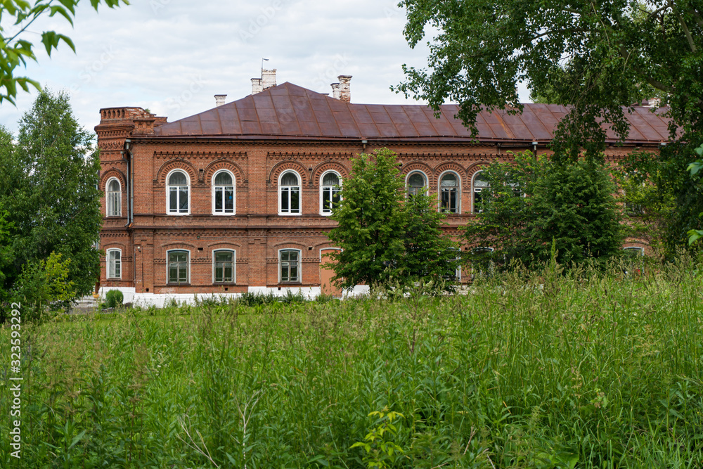 Old two-story red brick house