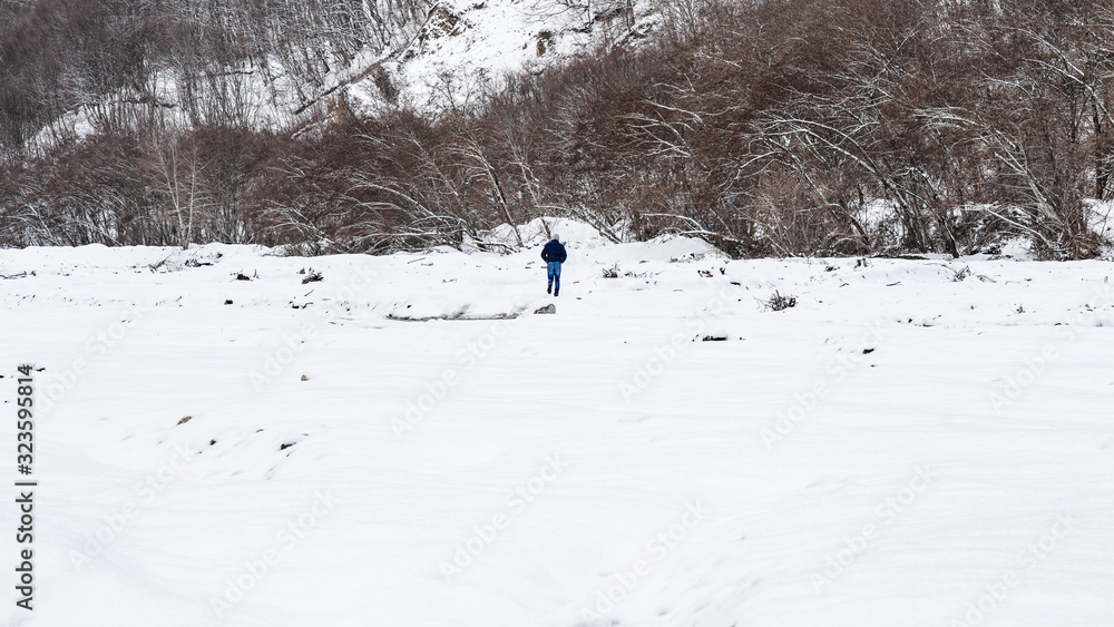 A lonely man walks in the snow A lonely man walks in the snow