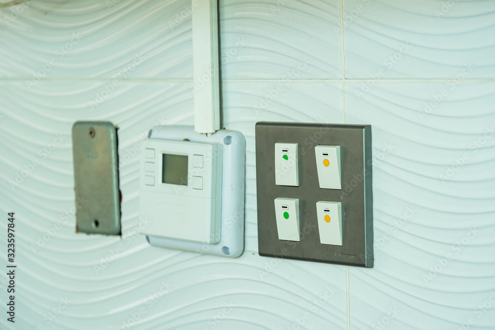 Light, electronic Switches panel on clean wall. Light, electronic Switches panel on clean wall.
