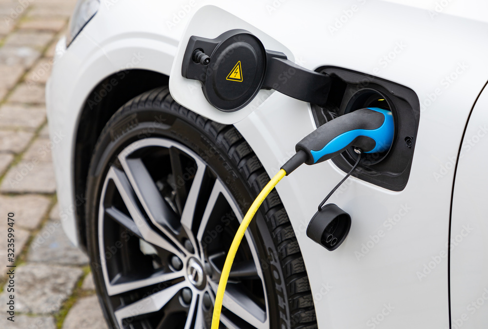 Charging of electric car in the city Charging of electric car in the city
