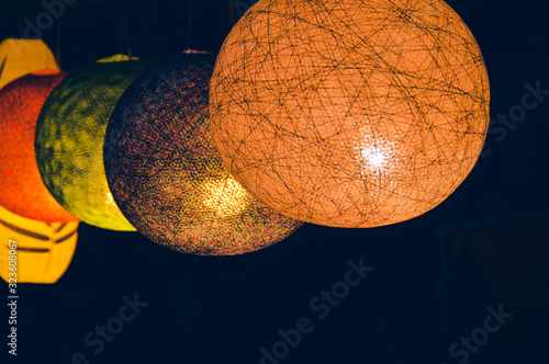 Beautiful Lao silk lanterns in the night market of Luang Prabang in Laos during the Bon Ok Pansa or Light Festival photo