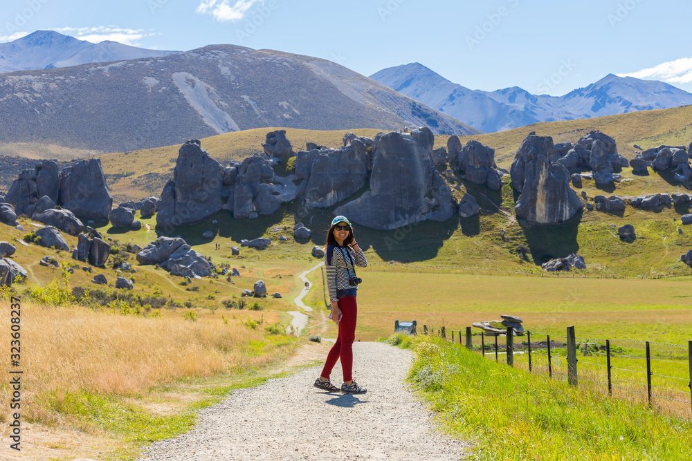 Summertime, Asian woman travel enjoy at Castle Hill, Arthur's Pass National Park, South Island New Zealand