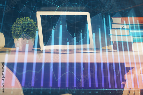 Financial market graph hologram and personal computer on background. Multi exposure. Concept of forex. © peshkova