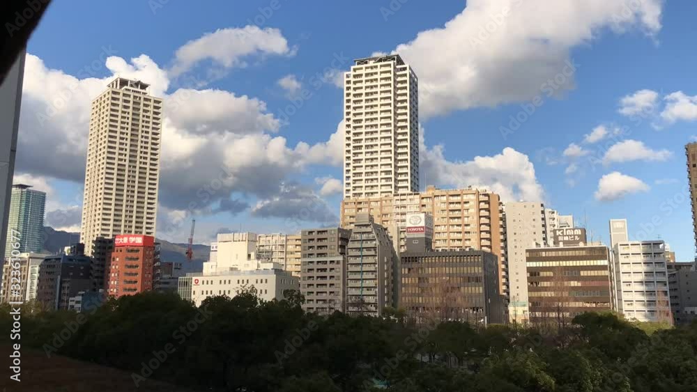 Time lapse of clouds passing over buildings in Kobe City, Japan. Time lapse of clouds passing over buildings in Kobe City, Japan.