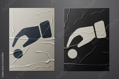 White Hand holding casino chips icon isolated on crumpled paper background. Casino gambling. Paper art style. Vector Illustration