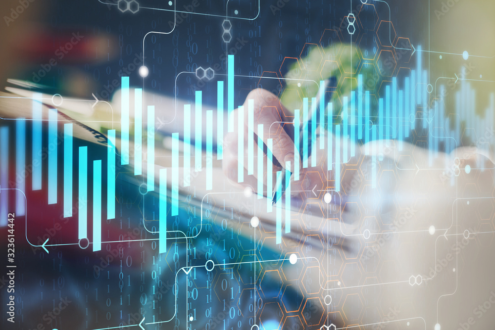 Financial forex graph displayed on hands taking notes background. Concept of research. Multi exposure Financial forex graph displayed on hands taking notes background. Concept of research. Multi exposure