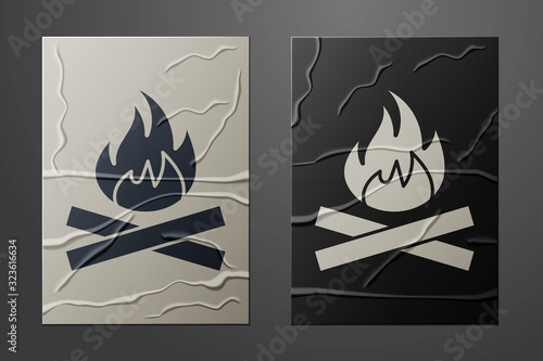 White Campfire icon isolated on crumpled paper background. Burning bonfire with wood. Paper art style. Vector Illustration
