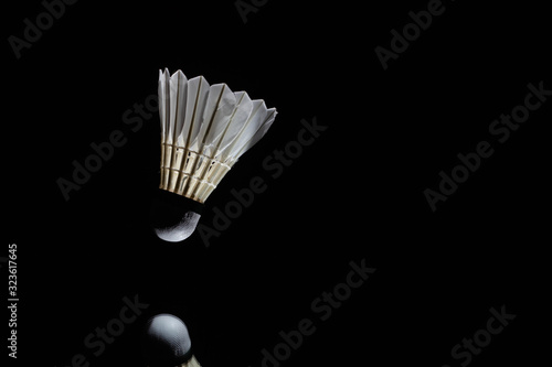 Badminton shuttlecock in a black background used in competition