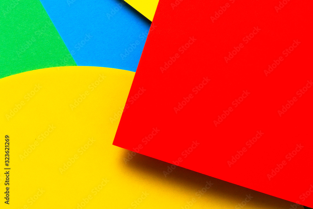 Abstract colored paper texture background. Minimal geometric shapes and lines in yellow, light blue, red, green colors Abstract colored paper texture background. Minimal geometric shapes and lines in yellow, light blue, red, green colors