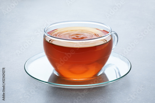 Cup of tea on a gray background.
