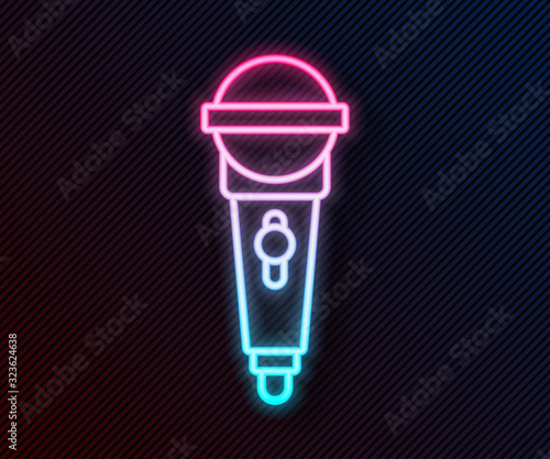 Glowing neon line Microphone icon isolated on black background. On air radio mic microphone. Speaker sign. Vector Illustration