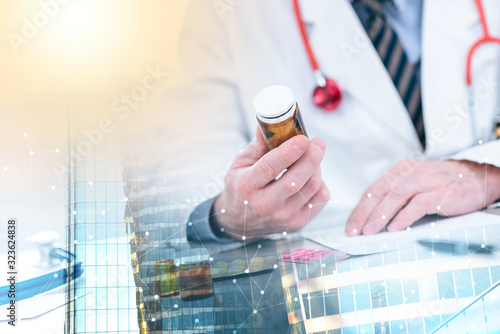 Doctor looking at a bottle of pills; multiple exposure