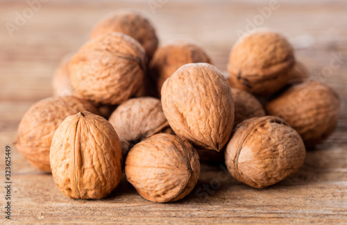 heap of walnuts isolated on white background