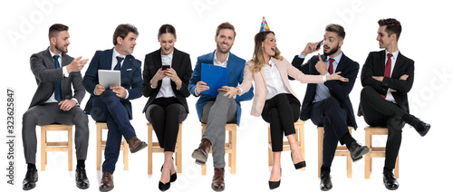 Team of 7 happy businessmen celebrating a coworker birthday