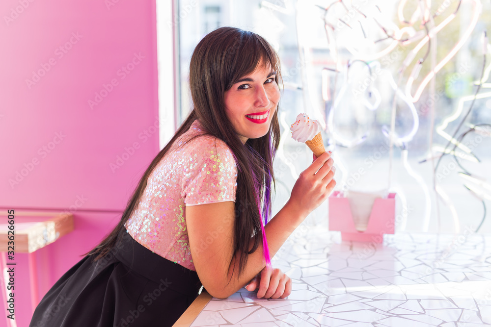 Summer, youth and dessert concept - Pretty girl enjoying an ice-cream cone in cafe Summer, youth and dessert concept - Pretty girl enjoying an ice-cream cone in cafe
