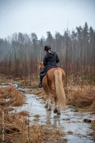 Woman horseback riding  © citikka