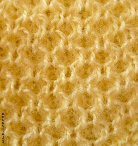 Knitted homemade fabric texture. Knitted background pattern. Modern knitwear fabric texture. Geometric decorative texture. Simple design background.