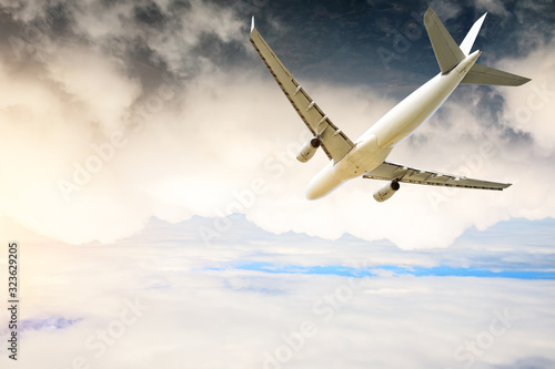 Airplane flying at high altitude and beautiful high-altitude clouds in spring