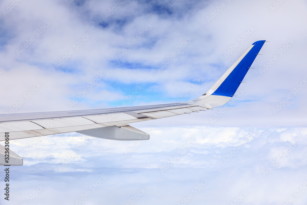 Airplane flying at high altitude and beautiful high-altitude clouds in spring Airplane flying at high altitude and beautiful high-altitude clouds in spring