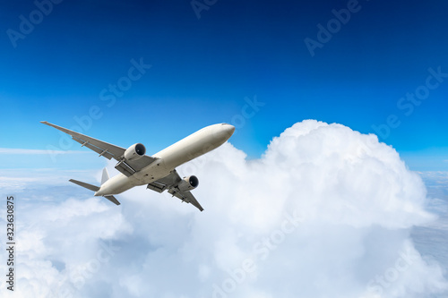 Airplane flying at high altitude and beautiful high-altitude clouds in spring