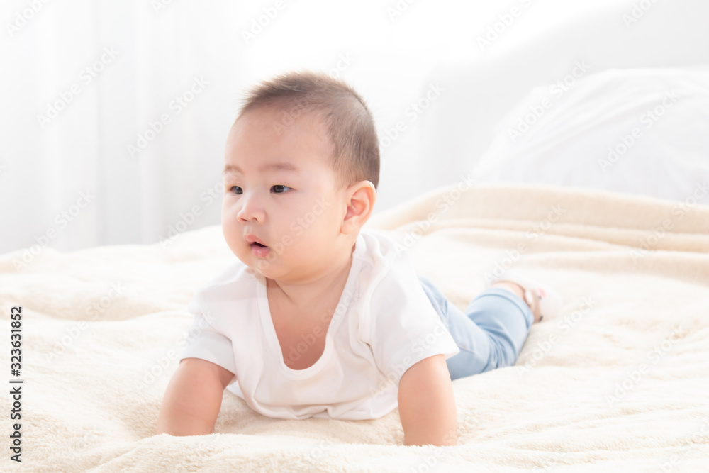 Asian cute adorable baby healthy boy good mood smiling laughing lie down on bedroom upturn playing with camera or mother, baby toddler, infant childhood soft skin happy face expression looking mom Asian cute adorable baby healthy boy good mood smiling laughing lie down on bedroom upturn playing with camera or mother, baby toddler, infant childhood soft skin happy face expression looking mom