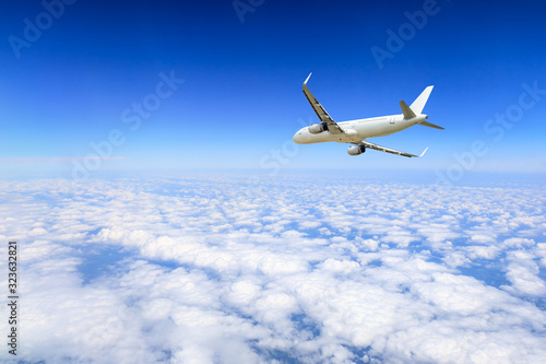 Airplane flying at high altitude and beautiful high-altitude clouds in spring