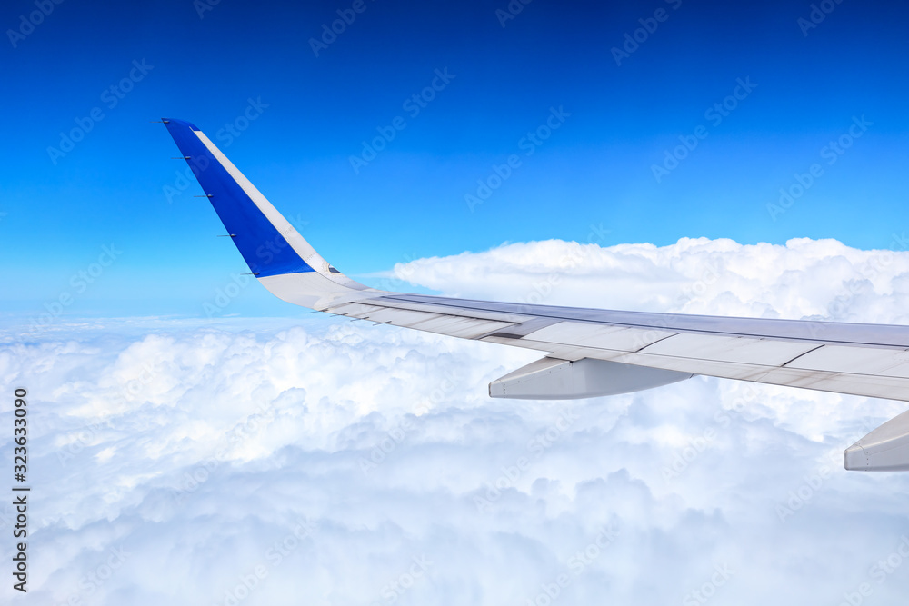 Airplane flying at high altitude and beautiful high-altitude clouds in spring Airplane flying at high altitude and beautiful high-altitude clouds in spring