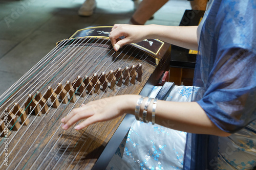 Women are playing zither, Chinese instruments