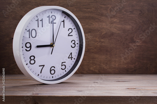 Wallpaper Mural wall clock at wooden table background Torontodigital.ca