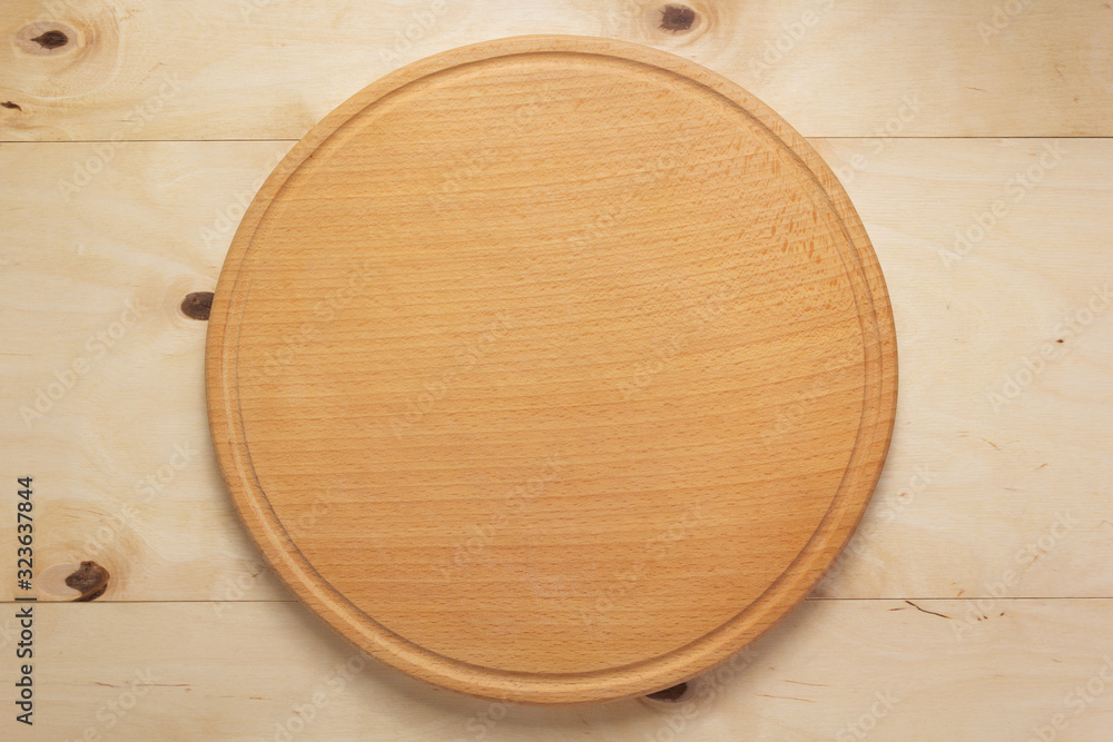 pizza cutting board at rustic wooden plank background pizza cutting board at rustic wooden plank background