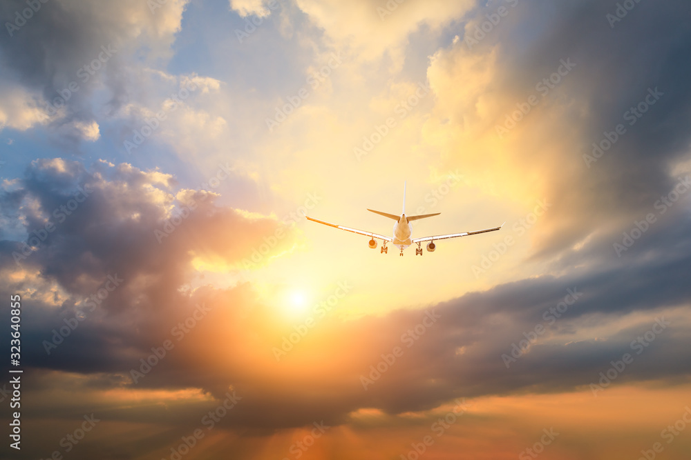High-altitude airplane and beautiful sky at dusk High-altitude airplane and beautiful sky at dusk